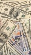 a pile of dollar bills