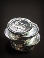 tower of coins on the black background