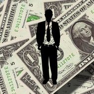 silhouette of a businessman on the money background