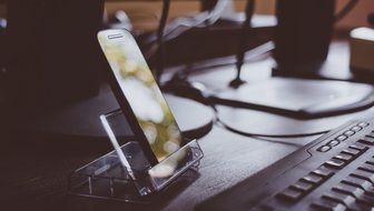 smartphone on the stand near the keyboard