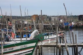 boats at wooden pier