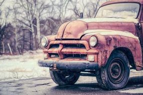 old red truck on the road