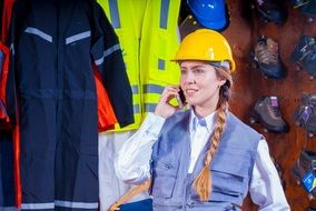 girl in a helmet at work