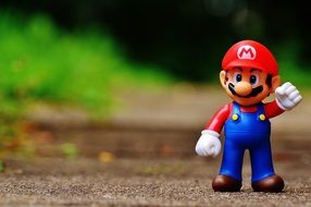 super mario figurine on the track