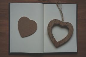 wooden heart on notepad