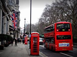 red phone cabin and red double-decker bus in London