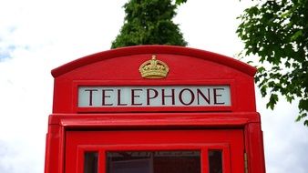 Beautiful red and white telephone booth in England