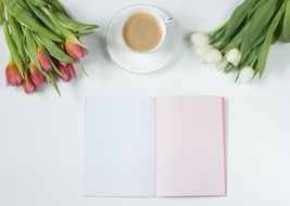 tulips, cup of coffee and notebook