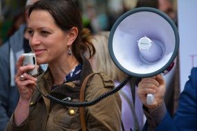 girl with a white megaphone in hand