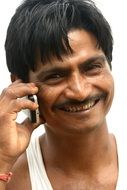 indian man is talking on the phone