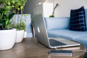 White mackbook and iphone on the tables