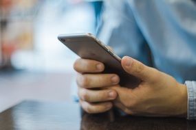 smartphone in hand close up