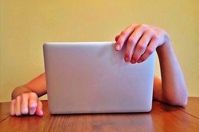 a child uses a laptop to study