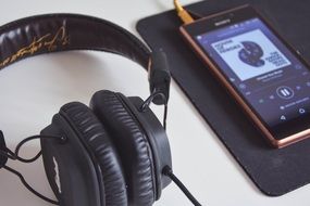 Headphones and phone on the table