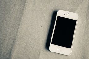 white smartphone on the kitchen table