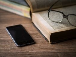 old book and smartphone