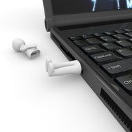 flash drive with legs in a laptop