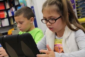 children use tablets in class