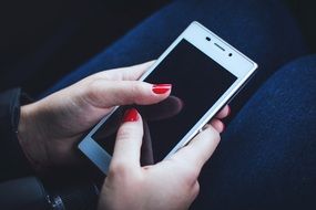 locked smartphone in female hands