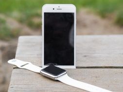 stylish white Iphone and Iwatch