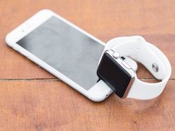 white Iphone and Iwatch