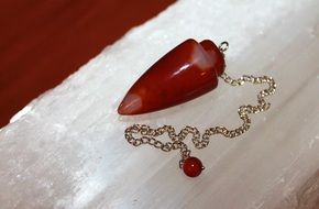 red gemstone Pendulum for Metaphysical use