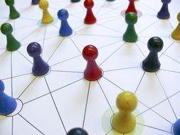 multicolored figures connected by a network