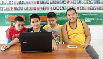 Boys at the laptop, Thailand