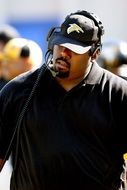 football coach with headphones