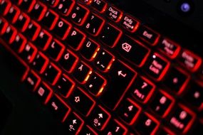 black computer keyboard with red backlight