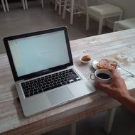 breakfast and laptop on the table