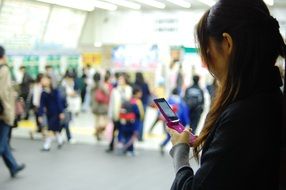 Women look in Mobile Phone