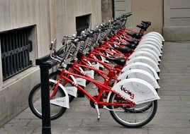 red bikes are parked on a street in Barcelona