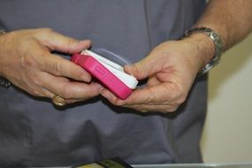 pink phone case in male hands