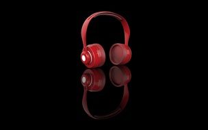 red headphones on black background