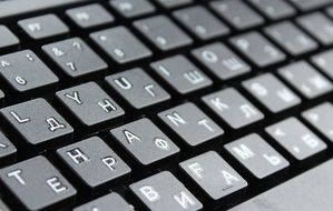 Black keyboard with white letters