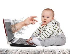 hand through screen of laptop computer stretches to Baby Boy, collage