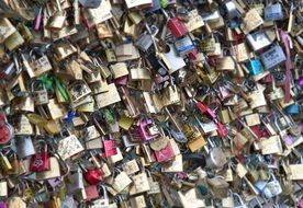 locks of lovers on the bridge grate