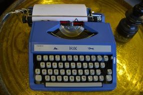 typewriter on a yellow table