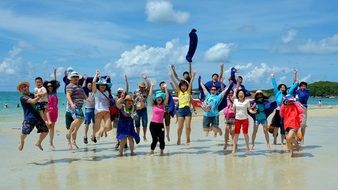 many tourists on a sunny beach