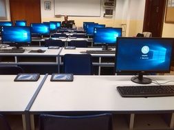 computers on the tables in the classroom