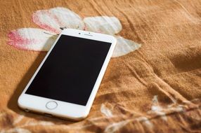 iPhone on bedding