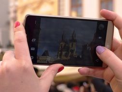 smartphone in the hands of a tourist