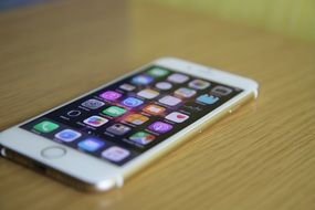 white iPhone on a wooden table