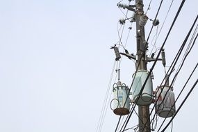 Power Pole With Many Wires And phone Cables Attached