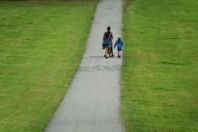 Mother with the child on the path