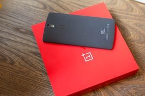 black One Plus smart phone on red box