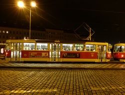 tram on rails in the night city