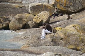 Man with Mobile Phone on rocks