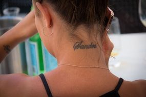 tattoo on the neck of a girl
